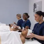 Three students preparing to be new spa owners with tips from Atelier Esthetique